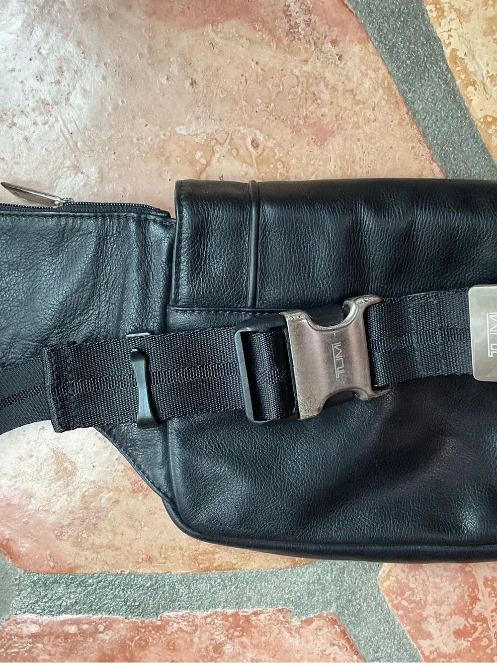 Black Leather Crossbody Sling Bag by Tumi unisex